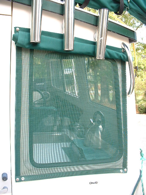 Mesh sun shade under the outer cover. These let light in but block a lot of the heat...like the ones you see on car windows. We also have one under the hatch opening in the berth.