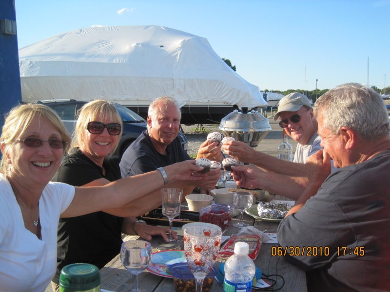 Mike Rizzo's Birthday and potluck diner at Shaws Boatyard in Dighton, Ma. as far up the up the Taunton River as we could go. Mike is at the end on the left. Toasting cupcakes what's up with that?