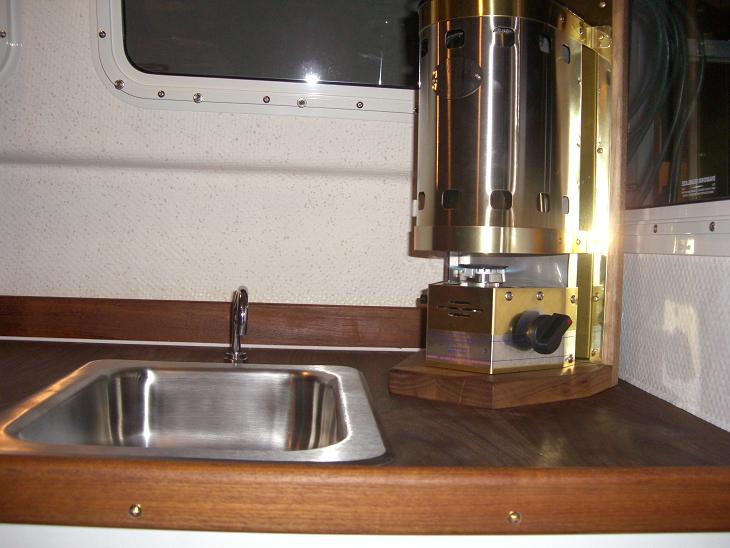moved sink over screwed wood mount from the bottom and then screwed brass kickplate to mount then cozy to brass kickplate