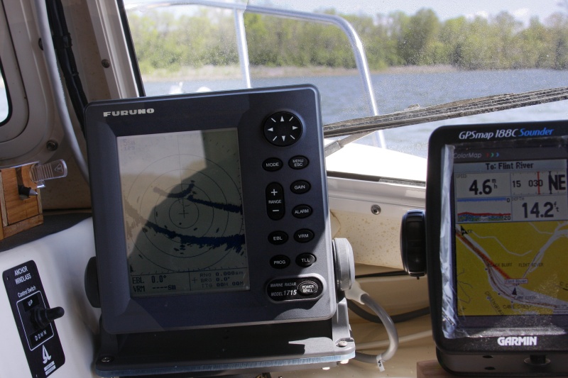 Moving from the Tennessee River to the adjoining Flint River dead ahead. The GPS route to the FLINT RIVER waypoint is shown on the GPS by a red trace. The Furuno 1715 Radar is interfaced to the Garmin GPS via communication ports. The radar displays a lollipop with the circle showing the entrance corresponding to the GPS waypoint. See the close ups of the GPS and Radar screen for better detail.