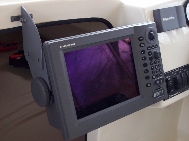 Multifunction Display 2...
I fabricated the custom bracket you see using a Dremel tool and the table mount bracket that came with the unit.  Metal paint primer matched the color of the Furuno unit perfectly.