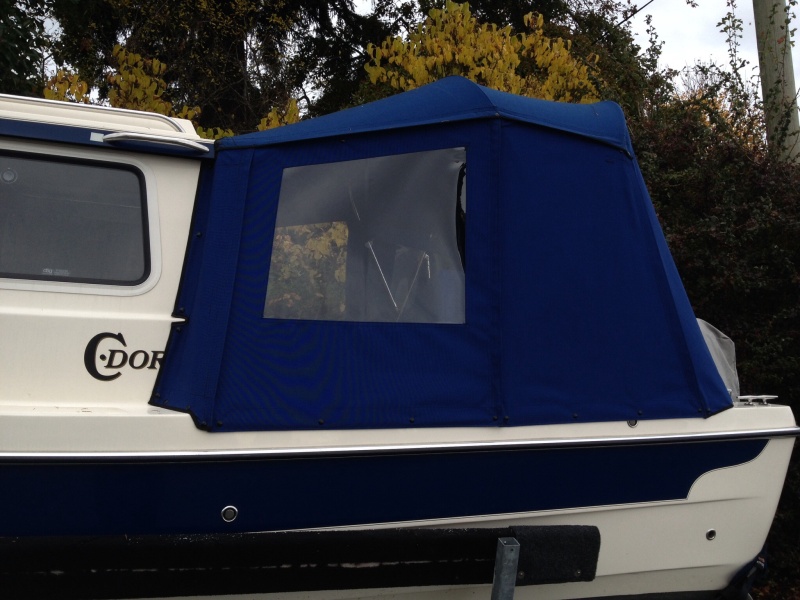 My canvas guy likes fabric where the frames are to give a bit more privacy aboard. I had thought a small window but we'll try this first.  We put the potty in the cockpit so this is going to be easy to enclose on the inside with snap up shower curtain