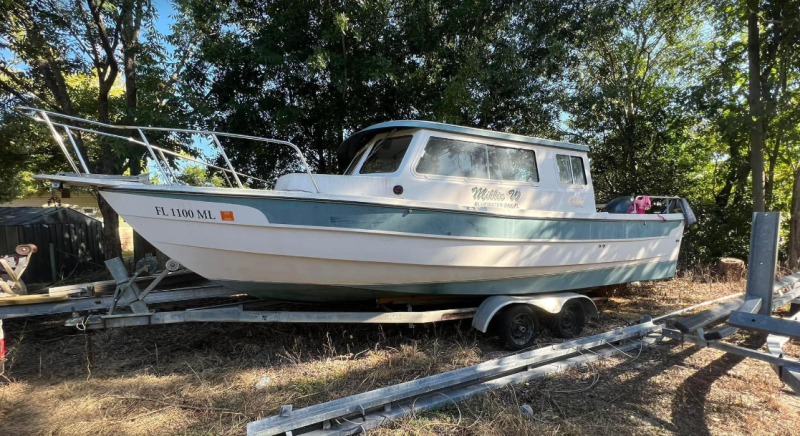 My \"fixer upper\" 25 cruiser the day I bought her. She had sat on a lift through hurricane Sally and needed some love.