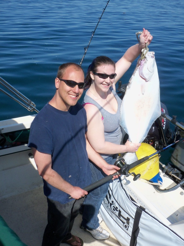My friend Norm and girfriend Heidi with the first hali in the boat.