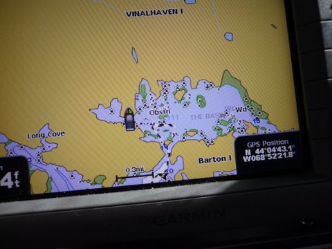 my GPS showing our route in to the basin it looks as though we should have went straight on the way in which is the way we exited more of a straight shot. The following from The Maine Guide book: "The Basin is a magnificent tidal lake cut in the west side of Vinalhaven Island. Here you will find a scattering of little islands, depths as great as 111 feet, and good swimming. The only problem is a narrow, crooked, and obstructed entrance through which the current usually rushes like a millrace. Entering the basin is not recommended except for the most daring of gunkholers. Rarely does a year go by without a grounding here. But others have done it. According to local lore, schooners used to winter over inside The Basin. The best time to enter or leave is within an hour of high slack tide. As if the current weren't bad enough, a rock sits directly in the middle of the entrance. The channel runs south of this rock and immediately branches at a small island. Once safely through the channel, you can enter The Basin either to the left or right of the small island, but the right branch is wider. Another rock lies to the southeast of the island. Head southeast past the island, keeping the rock to port, then turn slightly to port, rounding the rock and heading east into The Basin. Anchoring options are plentiful. So are the rocks. Be careful."