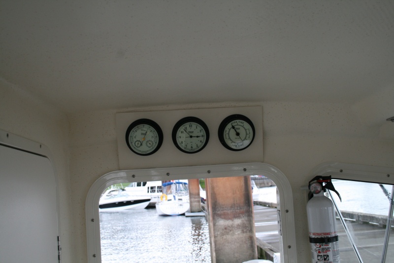 My "weather station" mounted above the cabin door - Weems & Plath Barometer, Clock and Tide Clock (Nightwatch in black finish)