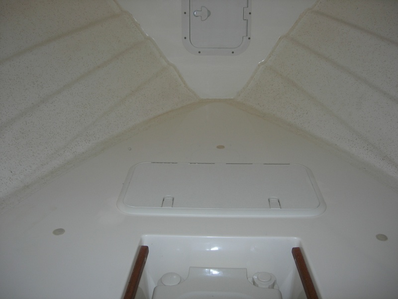 New 12x24" storage hatch in v-berth.  Hatch cover made by T-H Marine.