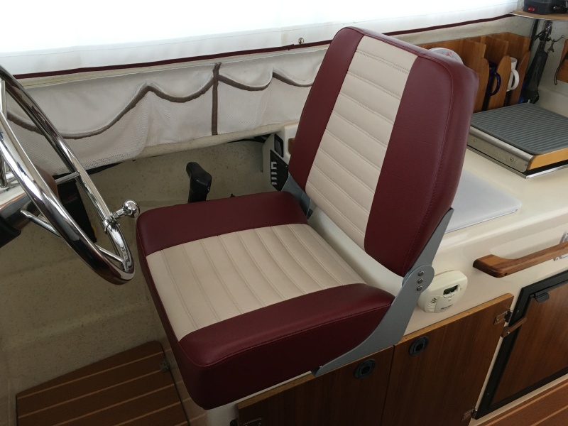 New custom helm seat from Bentley?s Mfg in Portland, OR.  This is their ?large? Sport Deluxe.  Well made, comfortable with good support, and easy to install.     It is soooo much better than the original seat!!!
