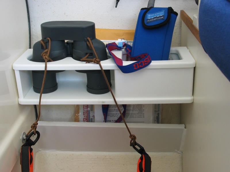 (Not For Hire) Binocular rack etc. at helm. Lower piece along with the back of binocular rack makes a chart, and manual rack.