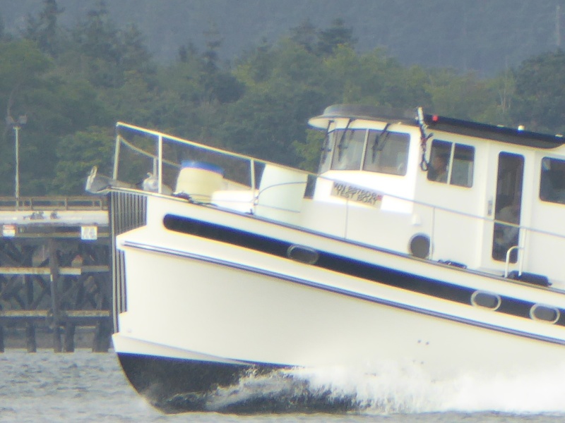 Notice the two 55-gallon barrels of water on the bow and "Test Boat" registration plate.