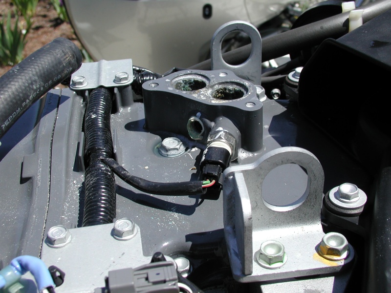 On the Port engine, I had to drill out the salt from this housing with a 1/4" drill! Salt deposits are visible in the Thermostat mounting areas.