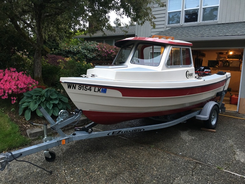 One of last photos before selling in 2017, but showing the 1990 Angler on a 2013 EZ Loader 14-18 2100 Roller trailer, fitting (just barely) under the 6'11" high garage door opening.