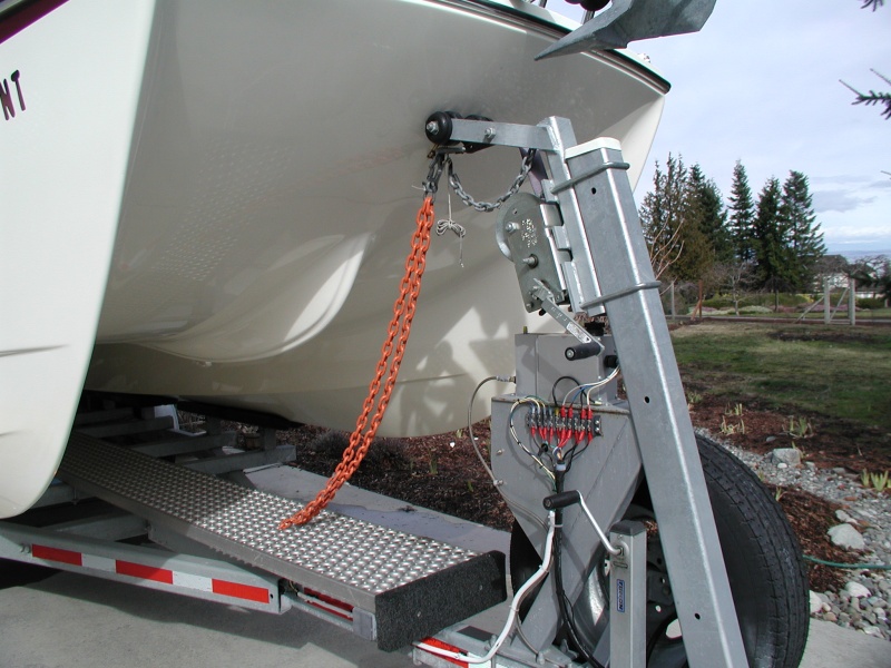 Orange chain installed after the Kingfisher II incident. More recently, added a chain binder to keep chain taut.
Hopefully it would keep boat from flying forward in a frontal accident.