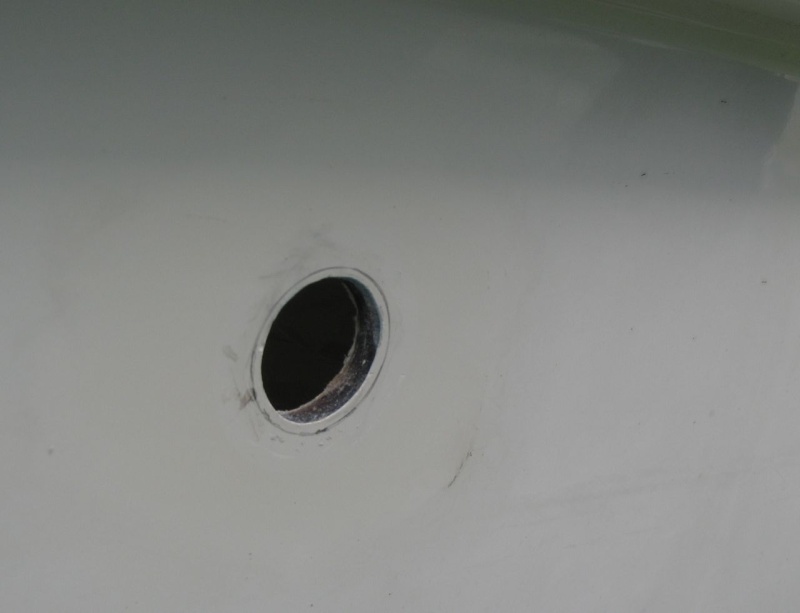 Original hole for 3/4" through-hull that connects to sink drain, marked for enlarging to fit 1" through-hull.