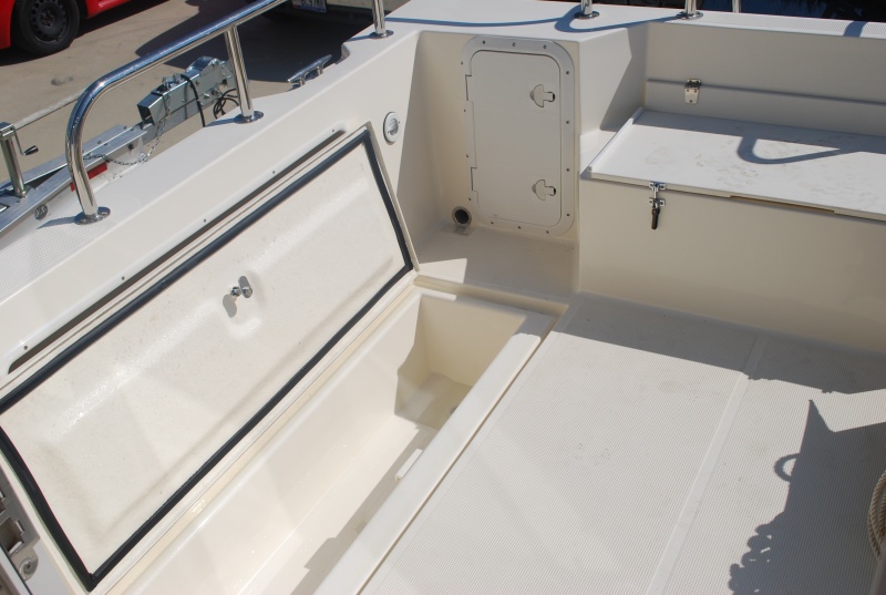 Our new 2009 Tomcat 255 "Destiny" at Wefings Marine in Eastpoint, Florida September 2009 - cockpit with fishing well open