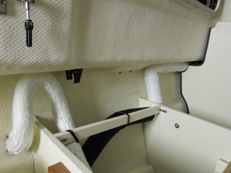 overboard exhaust and forward air return, return goes up to front of V-birth.