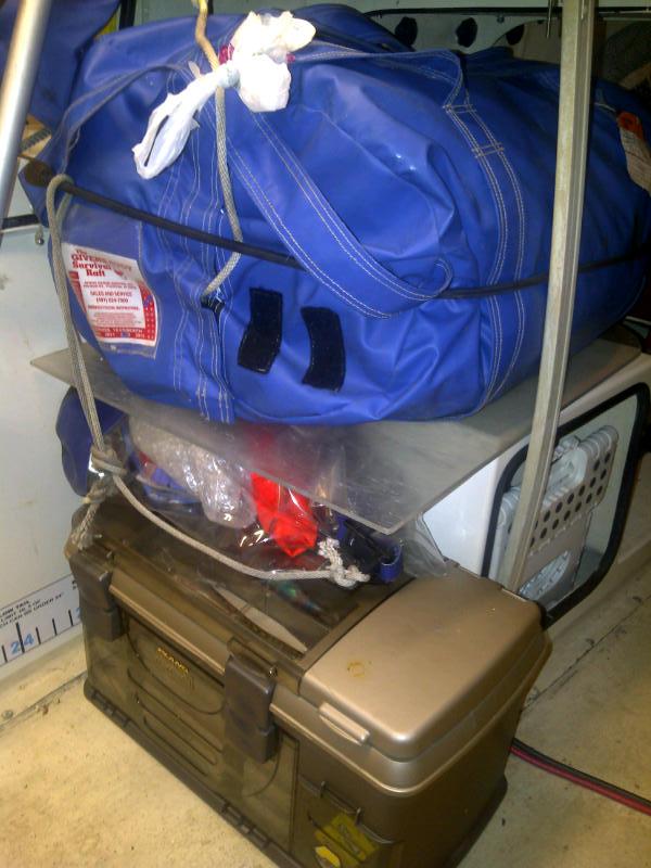 passenger seat mount now holds survival raft (blue bag)
