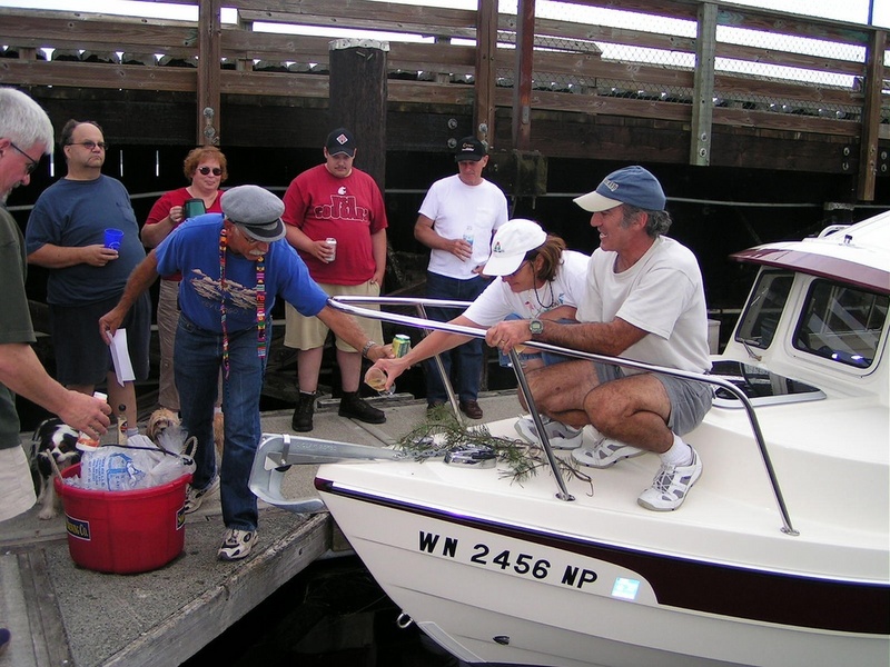 (Pat Anderson) Rev Dave Pours the Elixir on Two Lucky Fish to Appease the Gods