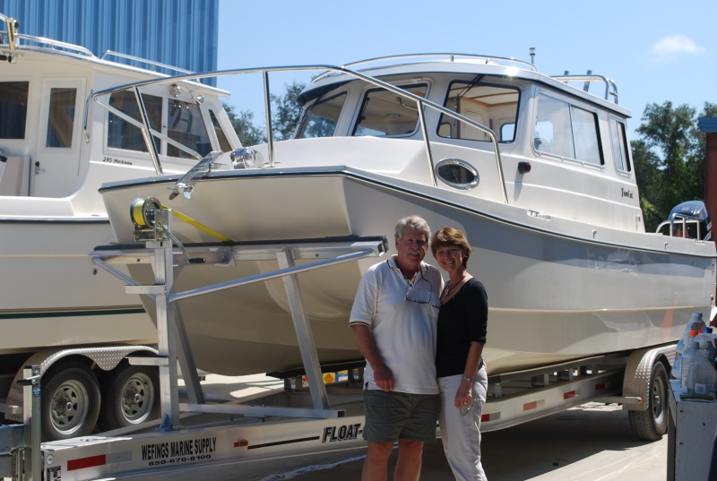Peter & Linda with their new 2009 Tomcat 255 "Destiny" at Wefings Marine in Eastpoint, Florida September 2009