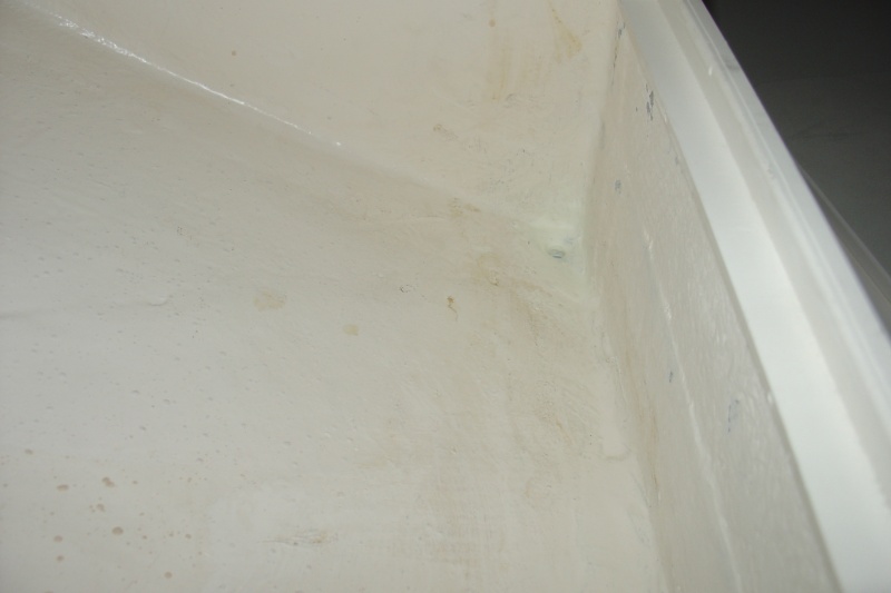Plugged side drain holes.  Built bottom to drain to starboard corner.  Also fiberglassed between anchor locker and port/stbd lockers.