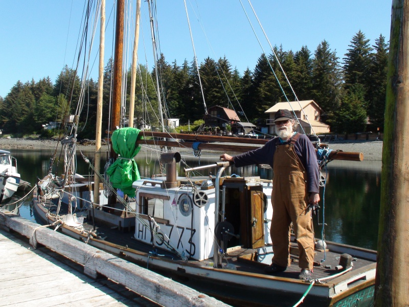 Port Alexander. Very small wooden fishing boat built in 1930 the owner shown here brought up from Port Townsend, Washington