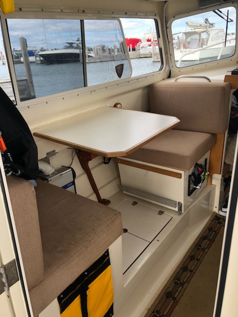 Port seating was sunbrella cloth.  14 years and kerosene heat and stove took their toll