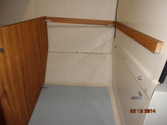 Preparing to add a shelf and a louvered door under the front port side seat.