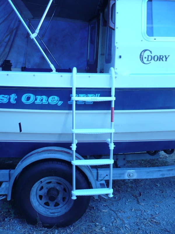 Probably a much better general solution. The $39 (on sale) West M 7" hook floating 4 step ladder. Standoffs lengthened 3" for CD setback. Stores easily right in front of gas tanks under cover in unusable space. Hand hold and bimini frame provide good high grasps and allow for taking a lot of weight off the ladder as boarder comes out of water.