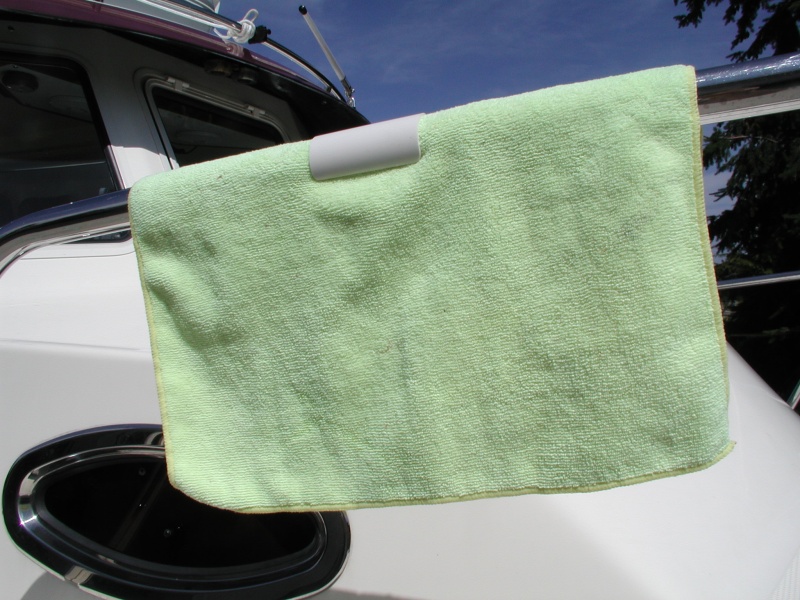 PVC clips snap on 1.25" rails to hold towels for fresh air drying.  Sort of a boater's clothes pin.