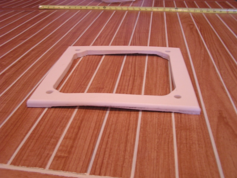 Radar mount plate cut from 1/2" Starboard
11" X 11" bottom carved to fit curve of roof (This is the first one and curve did not work)