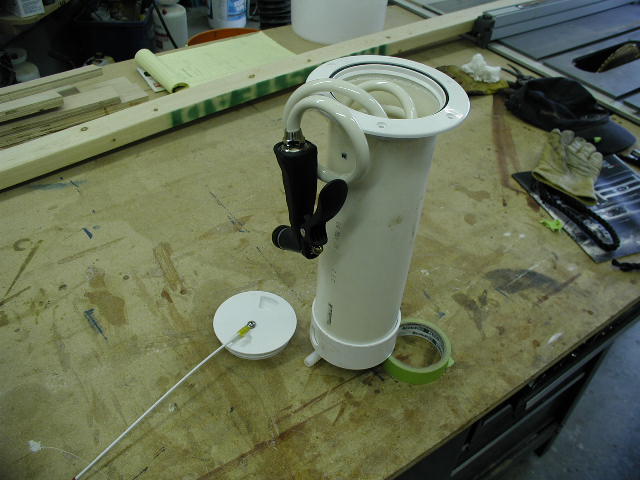 Raw water anchor and chain washdown system, made from 4" deckplate and 4" PVC drain  pipe and cap.