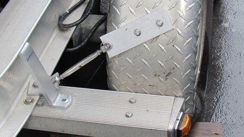 Ready to install fender brace provided by Float On.Seems like it should be longer and have different bends so it will attach further out on the fender mounting channel