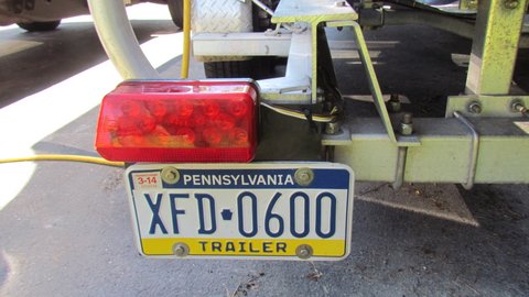 Rear view this should never break Used a 10.5" square piece of multiply conveyor belt. It can be cut with a sharp razor knife. Use over sized drill bits for holes when drilling the belt material. 30k + plus miles this is our original license plate.