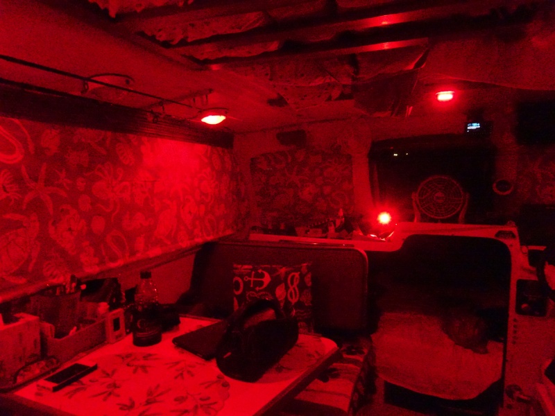 Red lighting fading forward.  There is the cabin red light up high.  chart red light below (can be white also), and the port forward overhead light is in red bright mode--it is also white in bright and dim motes.