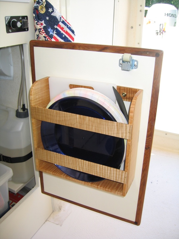 Right-hand cabinet door storage compartment.