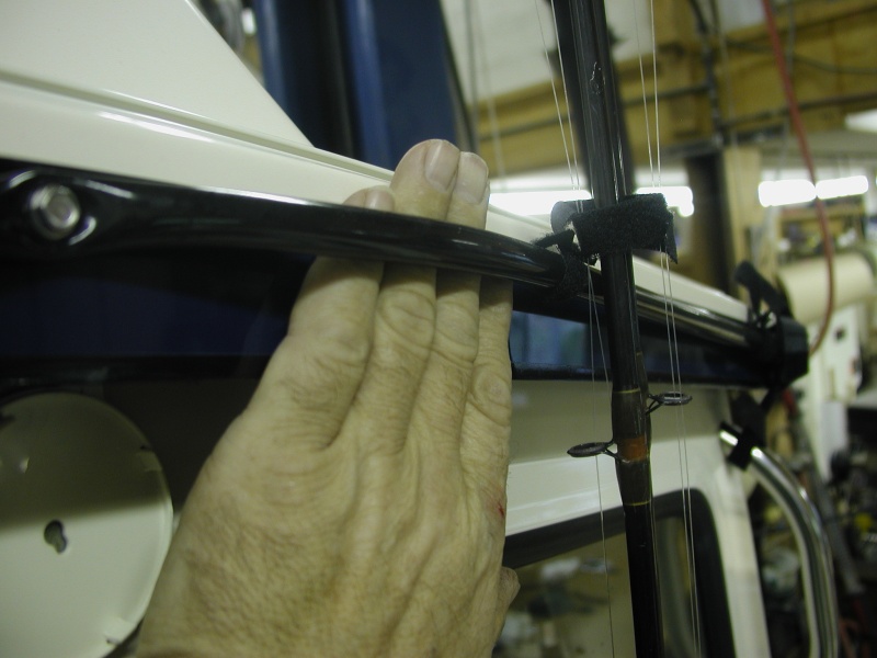 Rod protector: Rubber hose screwed to cabin roof edge.