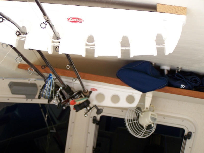 Rod storage on ceiling in cabin (4200 no screws) keeps rods out of the way and secured when we are off the boat.