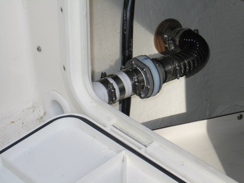 (Sea Skipper) Scuppers enlarged to 1-1/2? with modified check valve to prevent wave induced back flow into cockpit.  Thanks Les of EQ Marine for the parts!