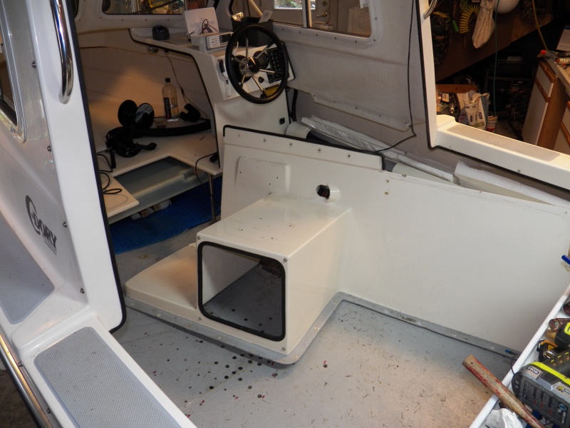 Seat box removal, showing the exploratory drilling on the port side that made me decide to remove everything.  The dark holes indicate bad balsa core.  The outer holes are marked "OK" with a red marker, although I may find that's a bit hopeful when I go further.