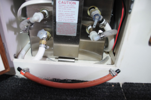 Seaward S700 Water Heater - 4 Pipes, open the two valves (drain and pressure vent) and connect the other two hoses (cold supply left, hot output right) on barbs together with 13" hose and two 1/2" double barbs.