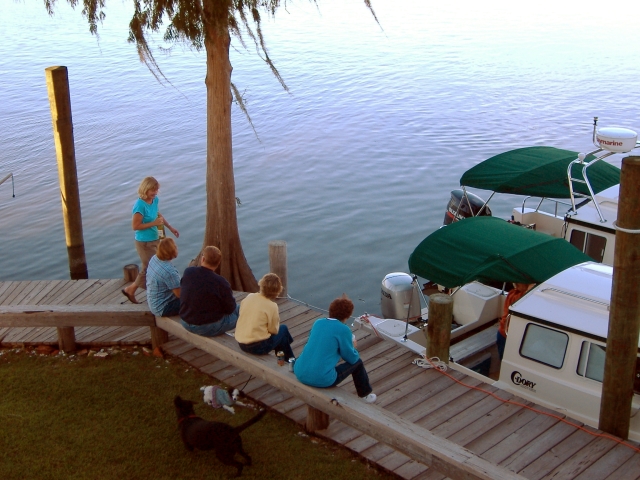 Setting on the Dock of the River