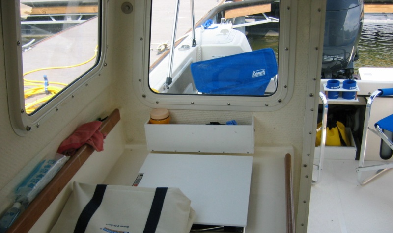 Shelf (made from StarBoard) mounted under starboard aft window