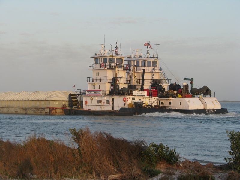 Six barges and two Tugs