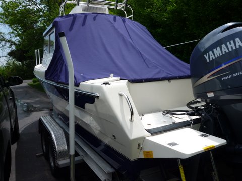 slant back canvas to keep cockpit clean and dry. Shares the zipper and snaps on rear of cabin with camper top obviously when camper top is not being used
