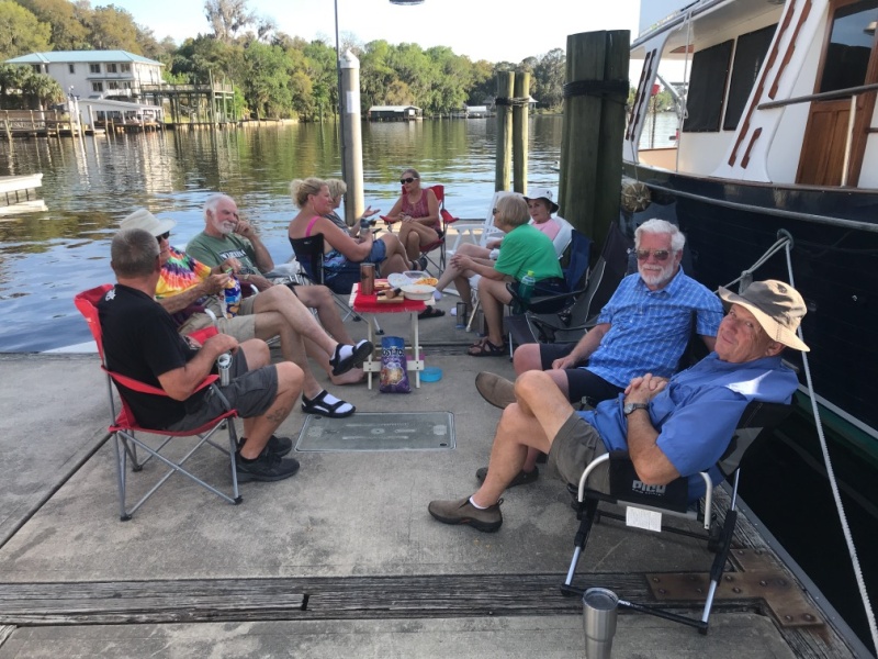 Socializing in the shade of a trawler at Welaka