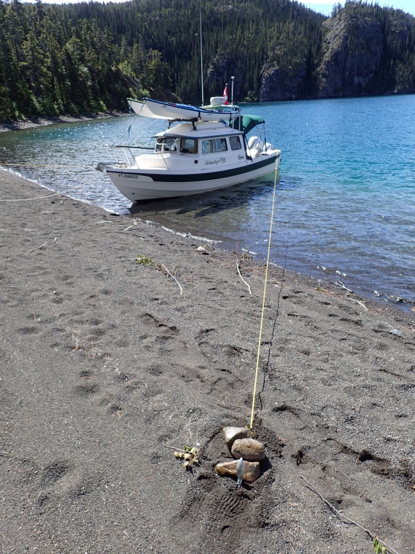 Spare anchor as a deadman from cross tying to prevent the boat drifting sideways in the wind.