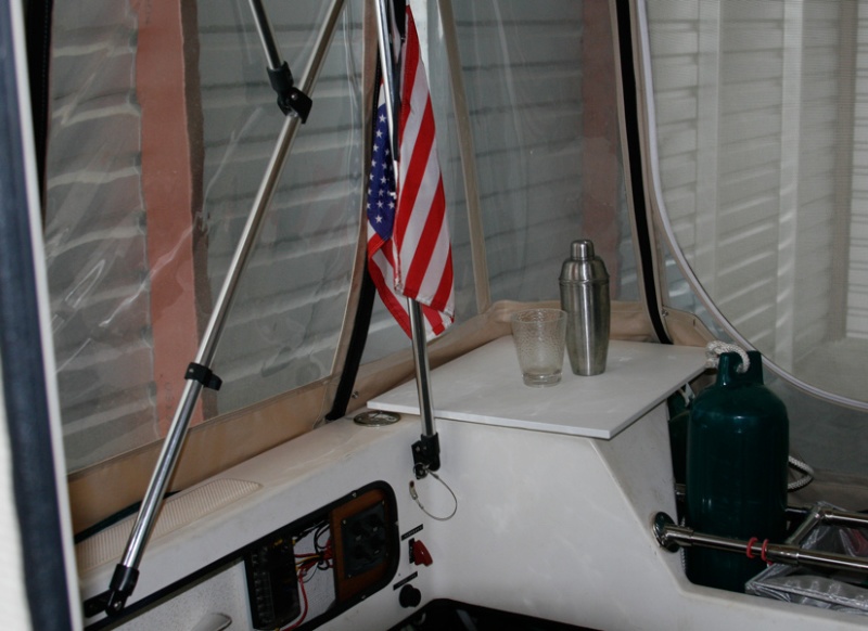 Starboard aft corner. Star board cutting board makes a useful flat surface on the lazarette which is held in place by the corner camperback panel and a grippy piece of rubber under the starboard.
