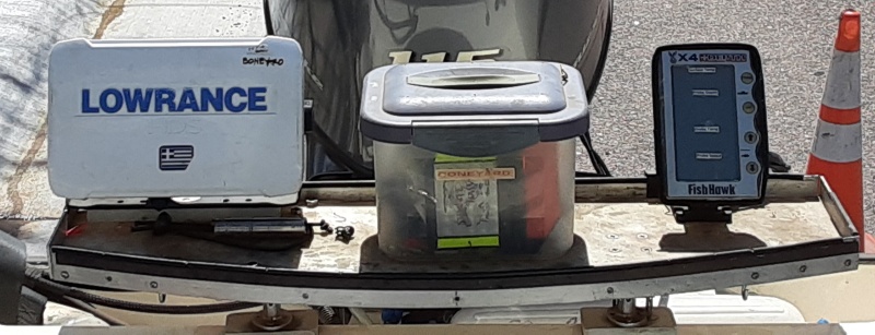 stern fishing work area with sonar, mini-storage, and temp/speed display on the right