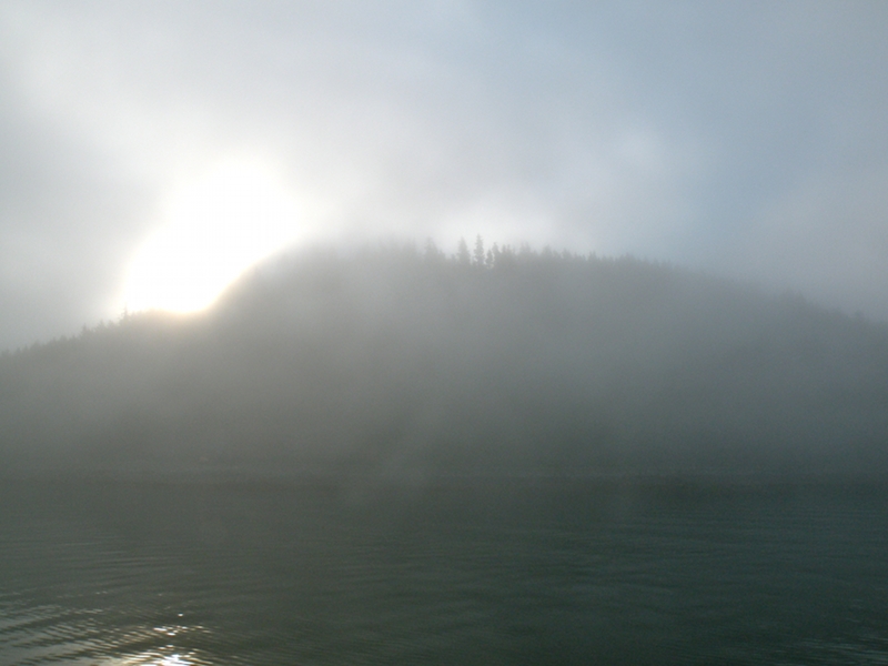 Sun burning off fog at outer entrance to Hoonah.