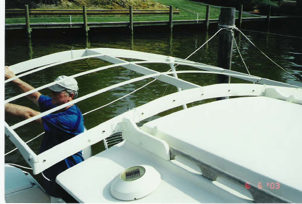 Support hooks to hand rails. No hole drilling required.